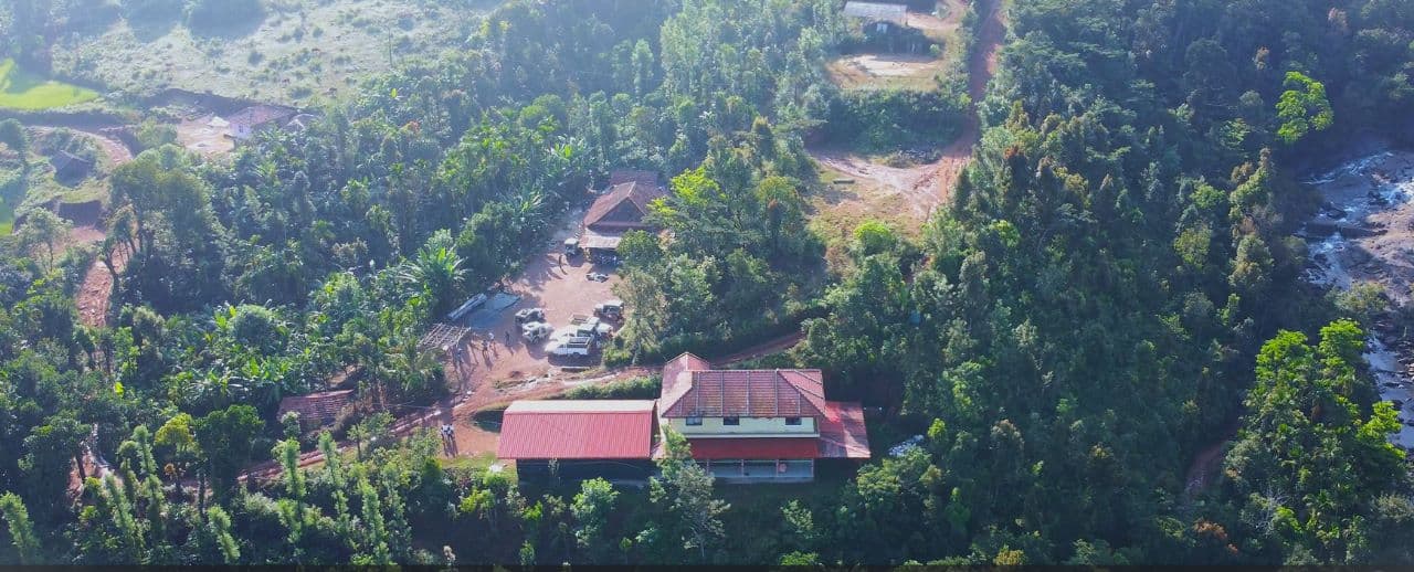Aerial view of Satish Mullodi Home Stay surrounded by forest in Mullodi village, Kudremukh